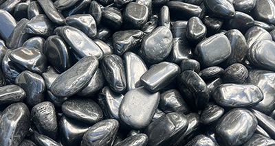 Black polished pebbles, alternate angle